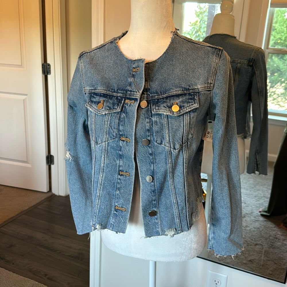 Distressed denim jacket